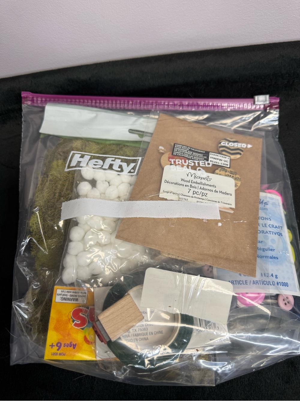 Various Craft Supplies with Moss and Buttons